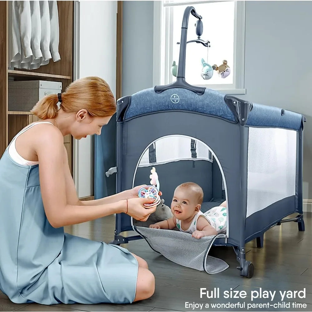 Bassinet Bedside Crib Pack and Play with Sheet Diaper Changing Table and Music Mobile Portable for Newborn to Toddlers